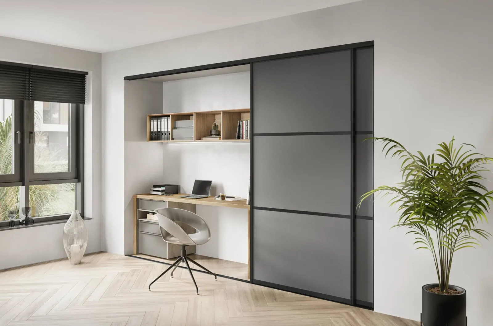Bureau intégré sur mesure dissimulé derrière une porte coulissante grise