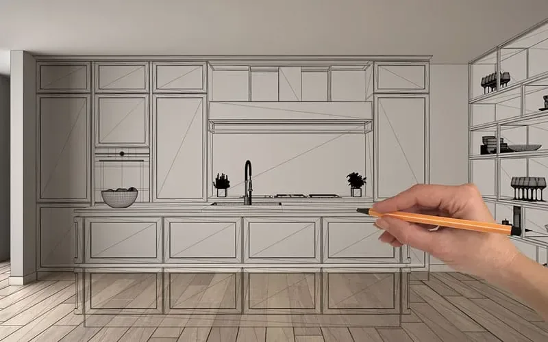 Croquis 3D d’une cuisine en cours de conception Cuisines ELITE, main dessinant au crayon